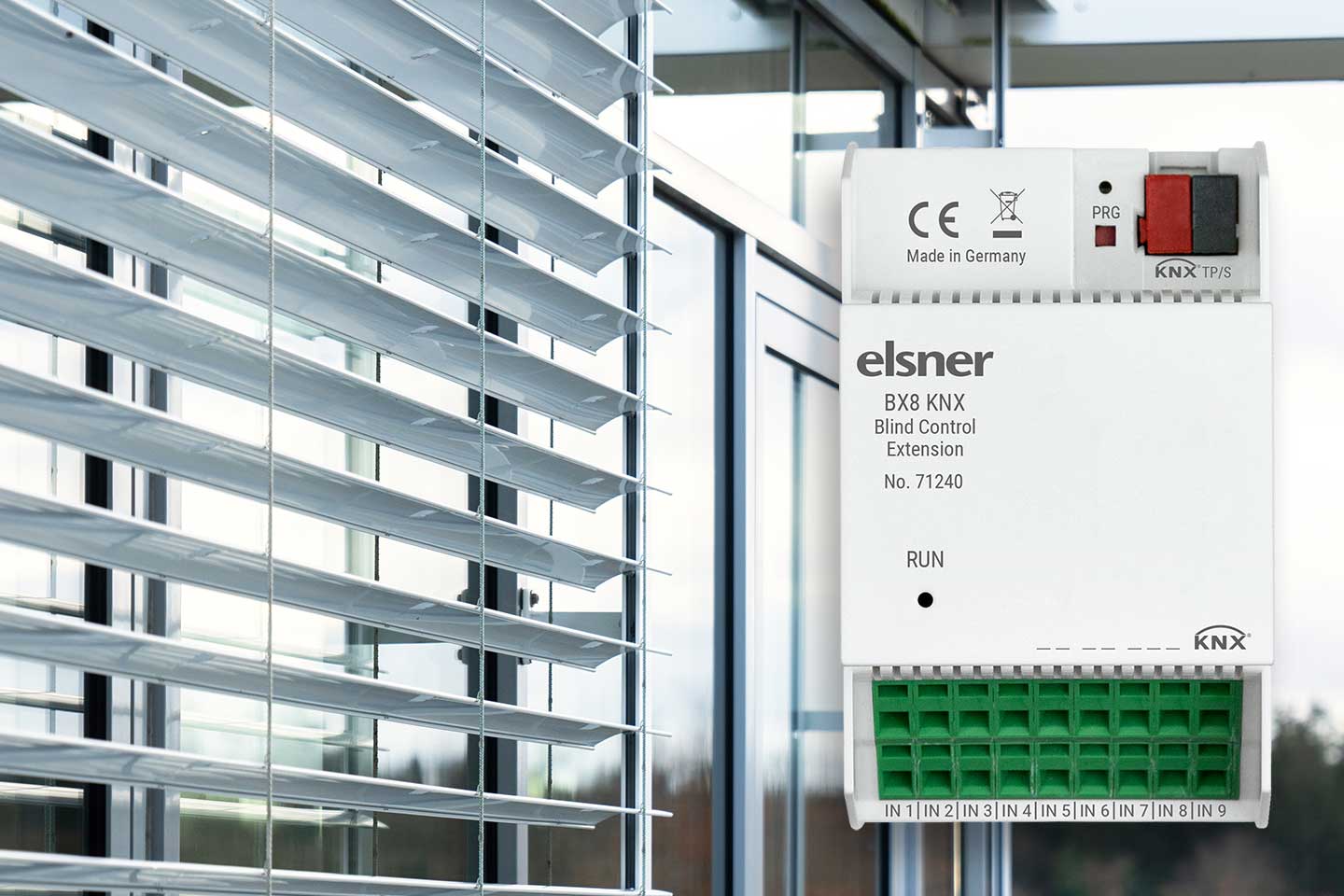 Elsner BX8 KNX Blind Control Extension device in front of a facade with exterior blinds