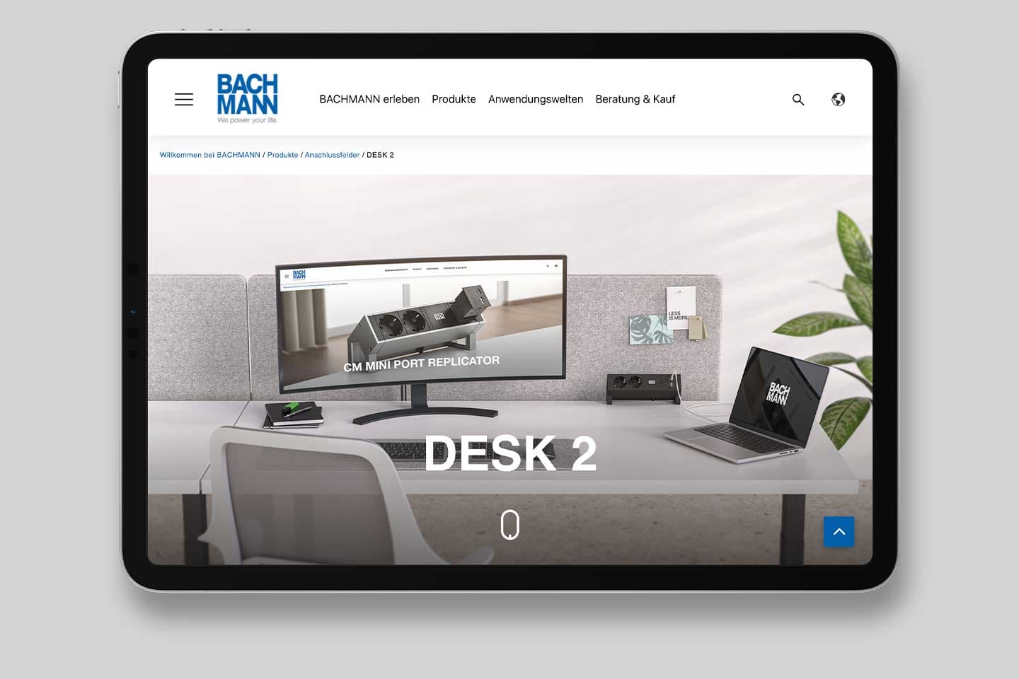 Tablet showing the BACHMANN website: product page “DESK 2” with an office workstation